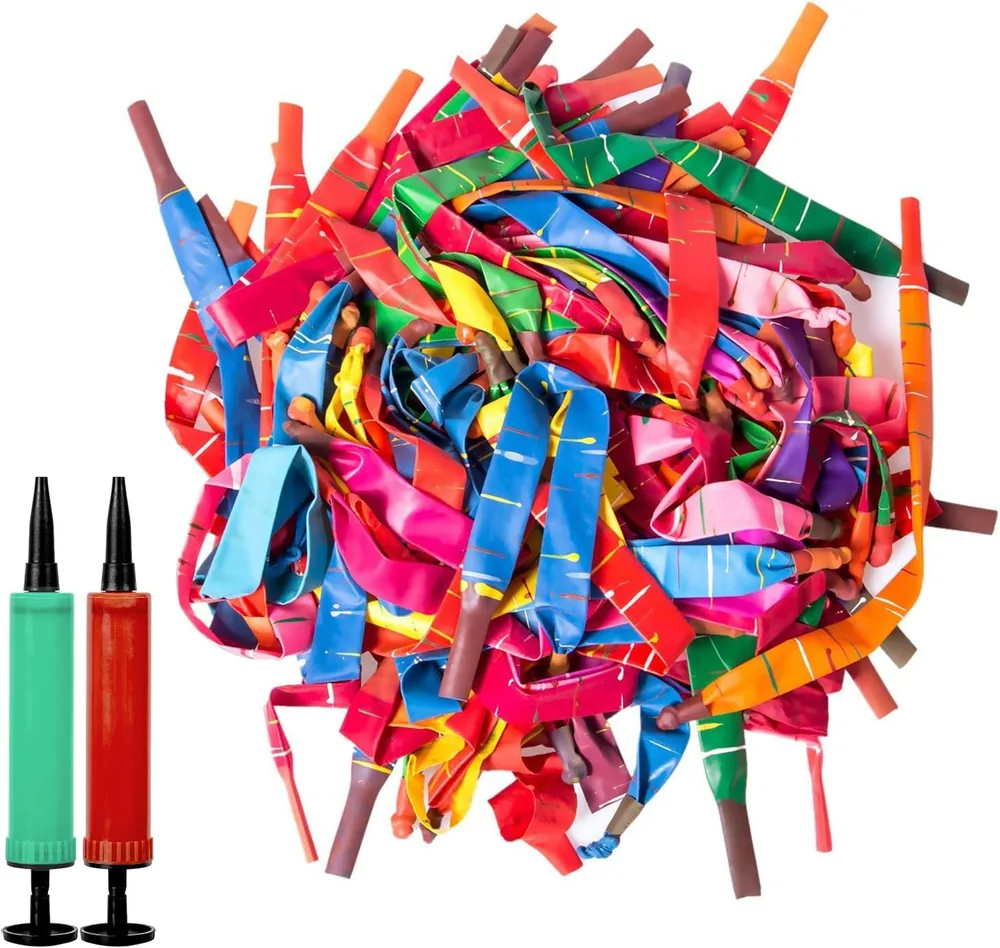 Pile of colorful rocket balloons with two hand pumps